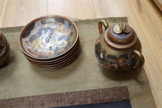 A Japanese embroidered silk scroll and a Japanese eggshell teaset
